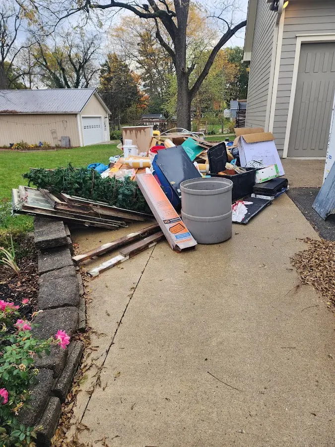 Dumpster being loaded with debris for Commercial Dumpster Rental in Cornelia